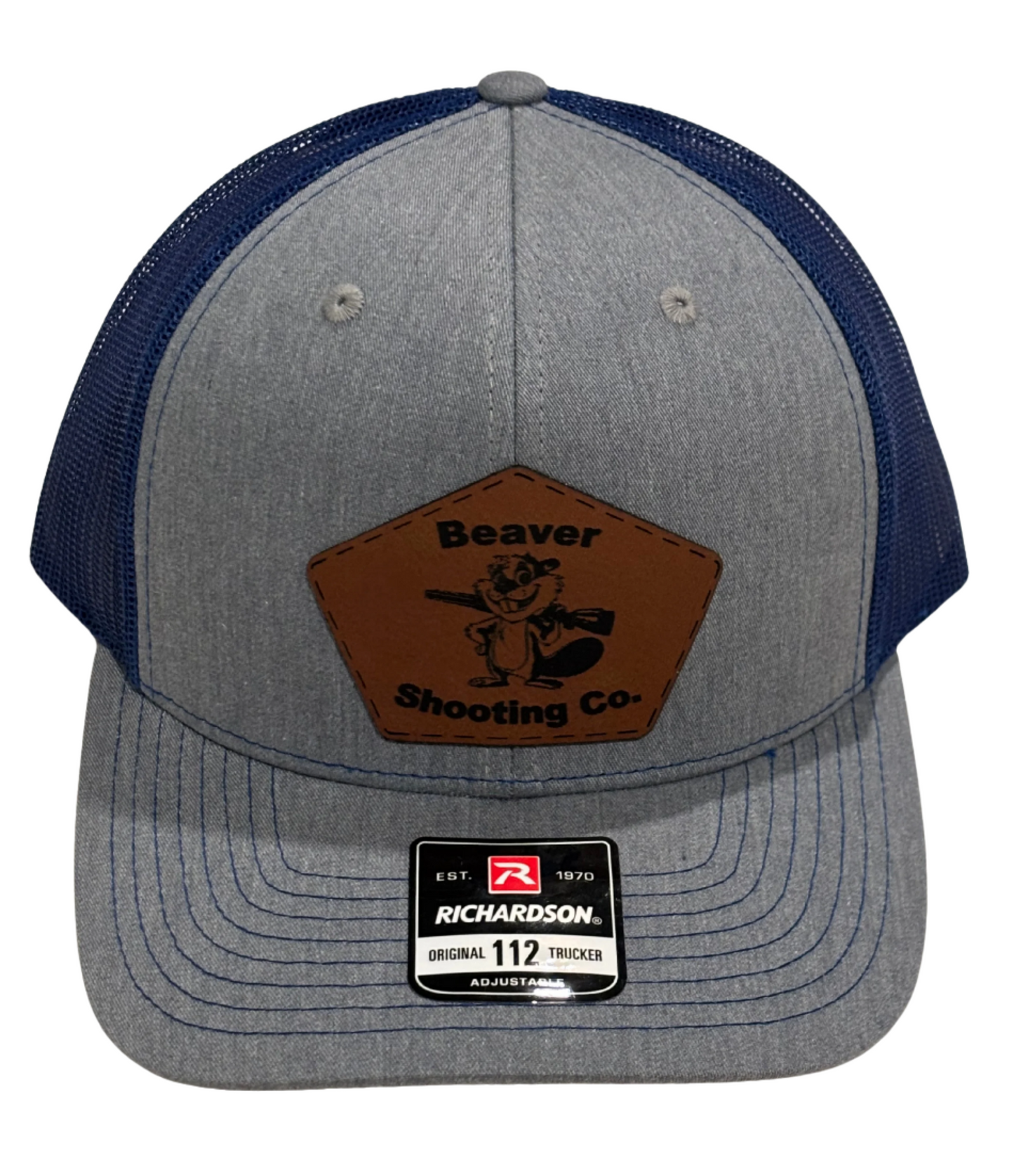 a gray with a blue back trucker hat by Richardson with the Beaver Shooting Company logo